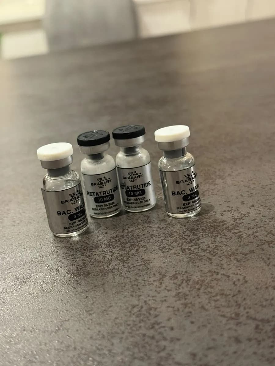 retatrutide 10 mg and bacteriostatic water 3 ml on a table