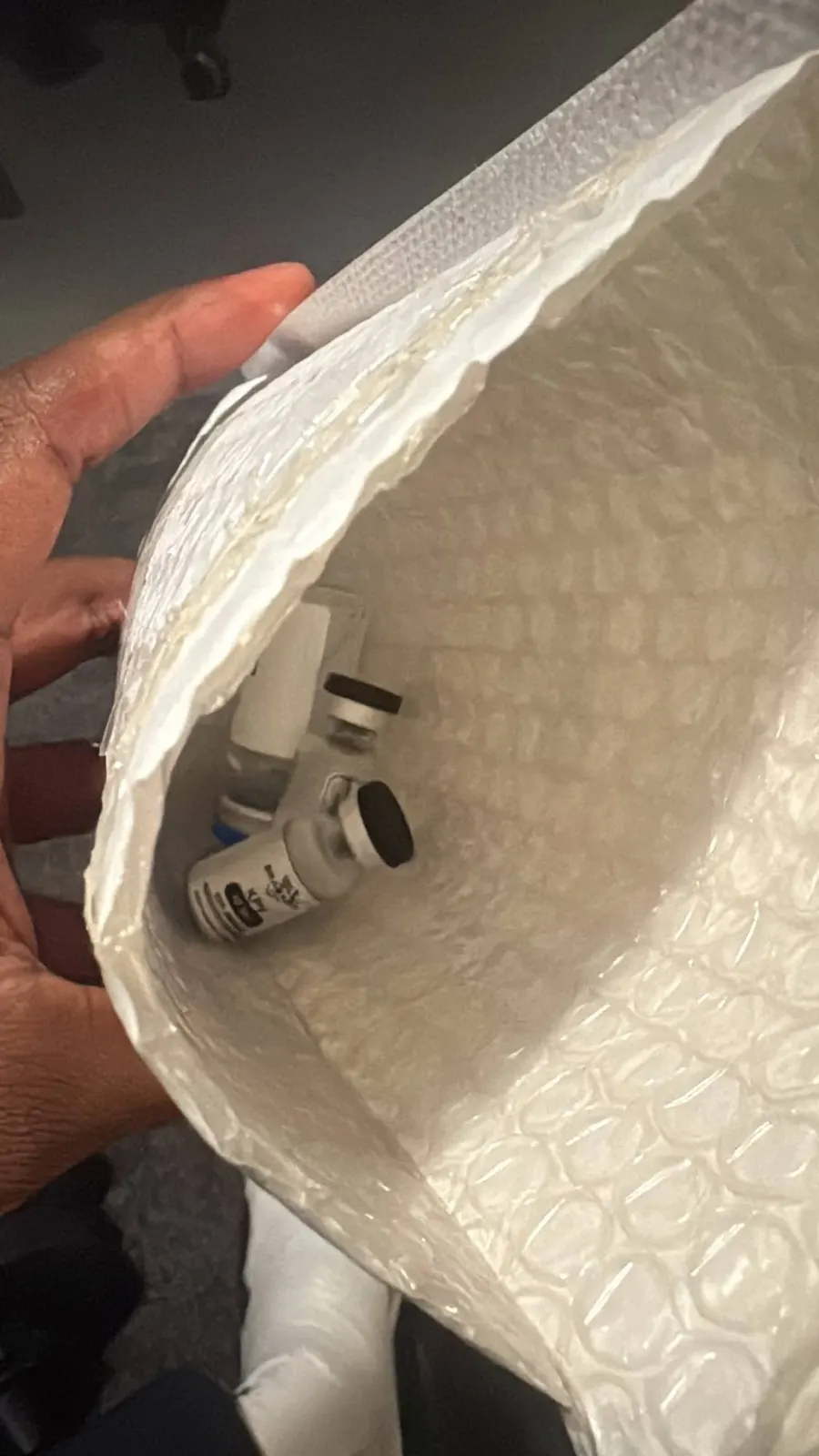 Vials safely packed in a padded envelope